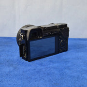 c) Sony Alpha A6000 + 16-50mm OSS Lens – Perfect for Photography & Video