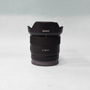 a) Sony E 11mm f/1.8 Ultra Wide-Angle Prime Lens | APS-C E-Mount | Fast f/1.8 Aperture | Lightweight Vlogging & Landscape Lens | SK1058