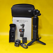 a) DJI Osmo Pocket 3 Creator Combo | 1-inch CMOS Sensor | 4K/120fps | 3-Axis Gimbal | Vlogging Camera Kit