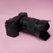 b) Sony A6400 Mirrorless Camera with 18-135mm f/3.5-5.6 OSS Lens | 24.2MP APS-C | 4K Video | Fast AF | SK522