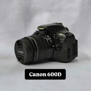 a) Canon EOS 600D DSLR Camera with 18-55mm Lens | 18MP | Vari-Angle Display | Perfect for Beginners & Creators SK1038
