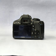 a) Canon EOS Rebel T2i DSLR Camera with 18-55mm Lens | 18MP | Full HD Video | Perfect for Beginners & Creators SK1039