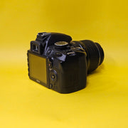 b) Nikon D3100 DSLR Camera with 18-55mm G VR Lens | 14.2MP | Full HD Video | Beginner Friendly DSLR | Budget Photography Camera | Code AB06 📸