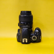 b) Nikon D3100 DSLR Camera with 18-55mm G VR Lens | 14.2MP | Full HD Video | Beginner Friendly DSLR | Budget Photography Camera | Code AB06 📸