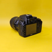 b) Nikon D3100 DSLR Camera with 18-55mm G VR Lens | 14.2MP | Full HD Video | Beginner Friendly DSLR | Budget Photography Camera | Code AB06 📸