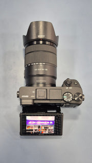 c) Sony Alpha A6400 + 18-135mm Zoom Lens (Excellent Condition)