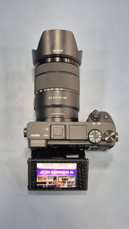 c) Sony Alpha A6400 + 18-135mm Zoom Lens (Excellent Condition)