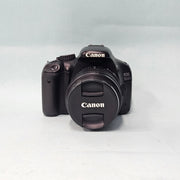 a) Canon EOS 550D DSLR Camera with 18-55mm IS II Lens | 18MP APS-C | Full HD Video | Beginner Friendly DSLR | Lightweight Camera | (Code AB05)