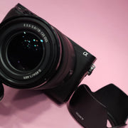 b) Sony A6400 Mirrorless Camera with 18-135mm f/3.5-5.6 OSS Lens | 24.2MP APS-C | 4K Video | Fast AF | SK522