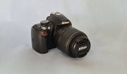 c) Nikon D3000 with 18-55mm Lens – 10.2MP DSLR Camera | Beginner Friendly | Sharp Image Quality