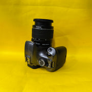 a) Canon EOS 1100D with 18-55mm f/3.5-5.6 IS II Lens | Beginner DSLR Camera for Photography & HD Video Shooting | SK196