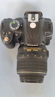 c) Nikon D3000 with 18-55mm Lens – 10.2MP DSLR Camera | Beginner Friendly | Sharp Image Quality