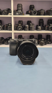 c) Sony Alpha A6400 + 18-135mm Zoom Lens (Excellent Condition)